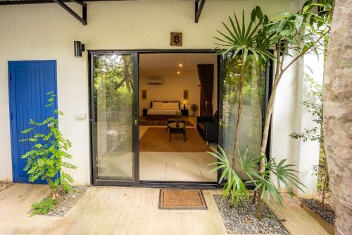 an open door of a house with a living room at 11 Rooms in Chiang Dao