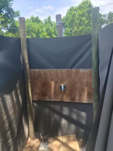 a wooden fence with a hole in it at Tent with a difference in Wilderness