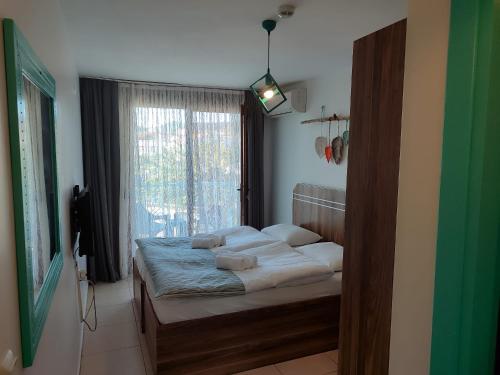 Ένα ή περισσότερα κρεβάτια σε δωμάτιο στο Foça Mint Hotel