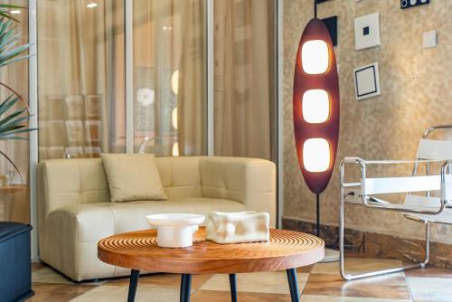 a living room with a couch and a coffee table at Misty Nest High Altitude River View B&B Hongyadong Branch in Chongqing