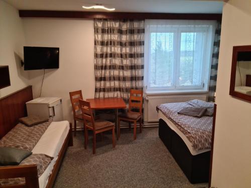 Postel nebo postele na pokoji v ubytování Motel Tošanovice