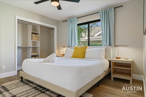 a bedroom with a large white bed and a window at Family 3BR 2BA Home Near Charming Main Street w Cowboy Pool by Austin Vacay in Round Rock