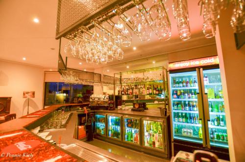 a bar with a lot of bottles of alcohol at Meninya Palms Resort Moama in Moama