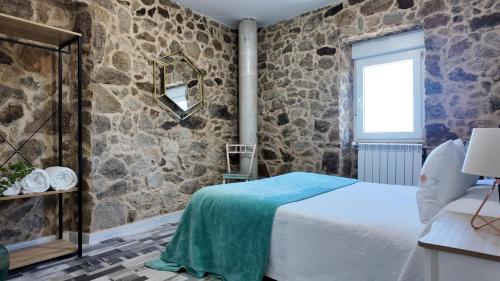 Un pat sau paturi într-o cameră la PANTON RURAL Casa Do José