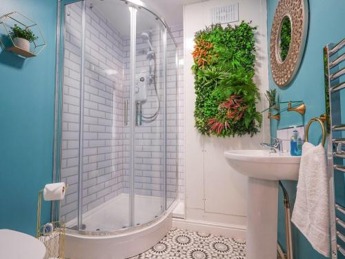 a bathroom with a shower and a sink at The Old Bulls Head in Chapel en le Frith
