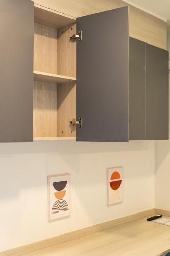a kitchen with two pictures on the wall at 44 Residence and Resort in Khlong Luang