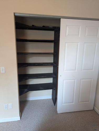 a closet with a white door next to a room at 12 mi from Parris Island Cozy home in Beaufort