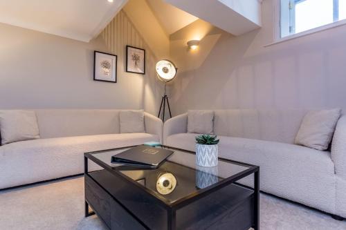 a living room with a couch and a table at St Andrews Court in Durham