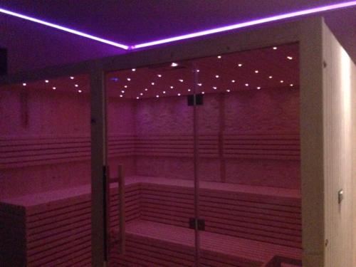 an empty room with purple lights on the ceiling at Agriturismo Monaco Di Mezzo in Resuttano