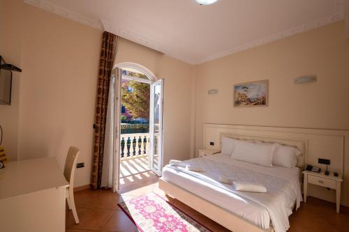 Ένα ή περισσότερα κρεβάτια σε δωμάτιο στο Olimpic Hotel