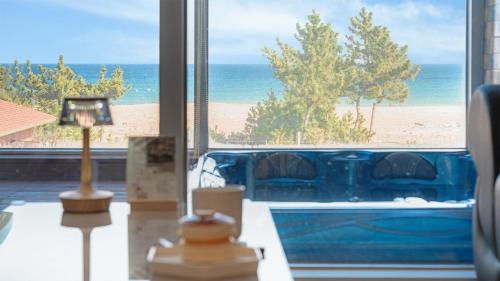 a living room with a view of the beach at Yangyang Oceanvibe in Yangyang