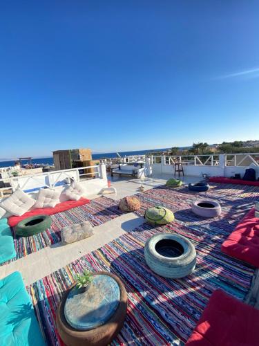 a rug with tires on top of a roof at Havana House in Dahab