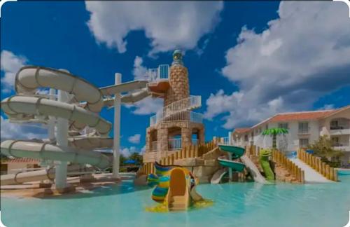 a water park with a water slide in the water at Luxury sea Cadaques Caribe in Bayahibe