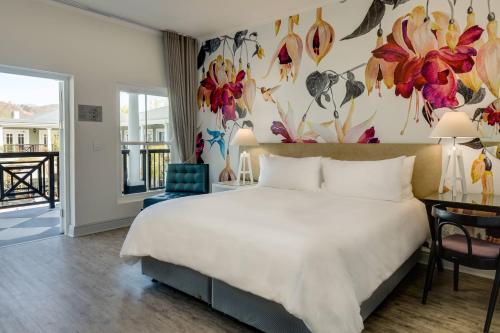 Ένα ή περισσότερα κρεβάτια σε δωμάτιο στο Protea Hotel by Marriott Franschhoek