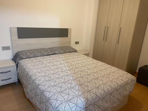 Ένα ή περισσότερα κρεβάτια σε δωμάτιο στο Apartament del Passeig