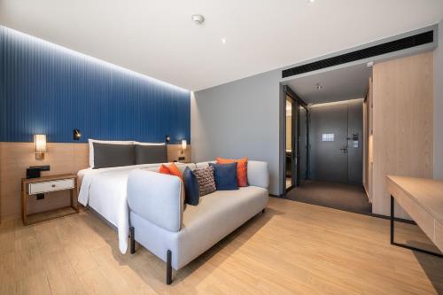 Katil atau katil-katil dalam bilik di Sindhorn Midtown Hotel Bangkok, Vignette Collection by IHG
