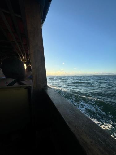 a view of the ocean from the inside of a boat at Pousada Bela Vista in Ilha do Mel