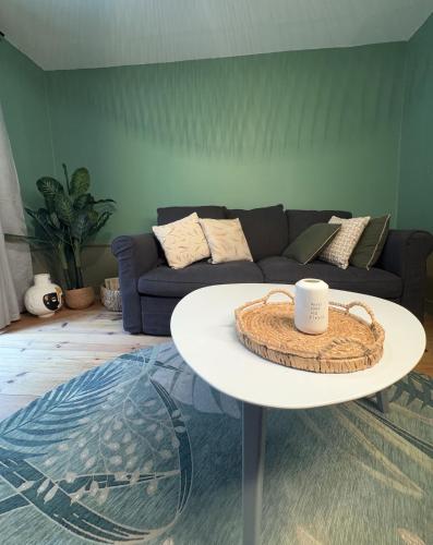 a living room with a coffee table and a couch at Le Village Montmartre by Hiphophostels in Paris