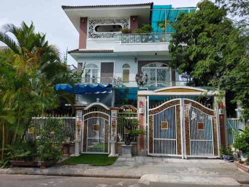 a house with a gate in front of it at Seaside Villas An Vien Nha Trang in Nha Trang