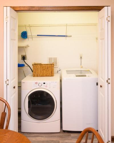a laundry room with a washer and dryer at Outer Banks Haven New Kitchen and New Outdoor Areas in Kitty Hawk Beach