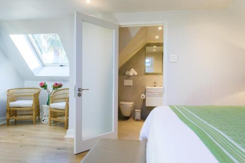 Ένα ή περισσότερα κρεβάτια σε δωμάτιο στο Luxury Apartments - Rozenhof Villa