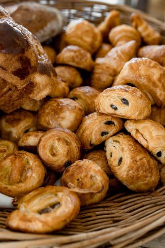 a pile of pastries sitting on a table at Mas de la Fouque - Hôtel & Spa in Saintes-Maries-de-la-Mer