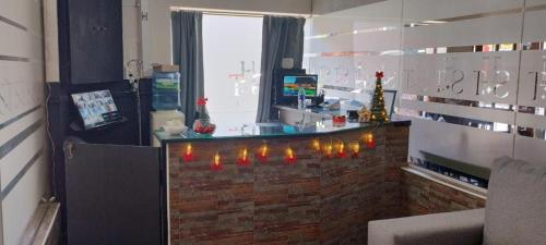 a bar in a room with christmas lights on it at hotel santa teresita in Santa Teresita