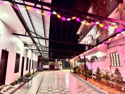 a hallway of a building with purple lights at Jungle Backpackers View in Vang Vieng