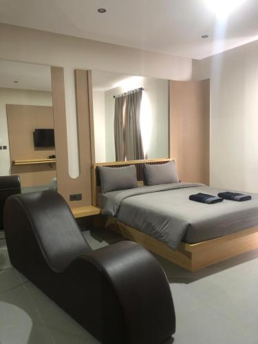 Postel nebo postele na pokoji v ubytování T - Hotel