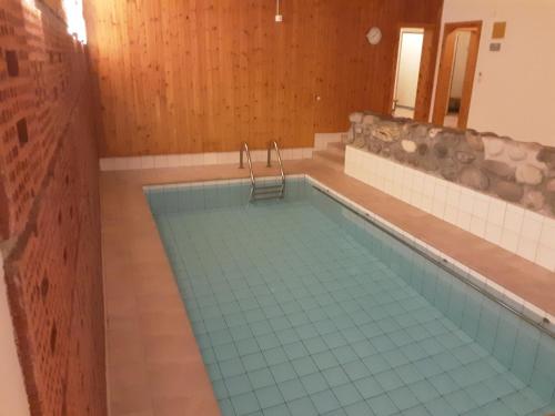 a large swimming pool in a room with at Ferienwohnungen Chesa Clois 24 in Lenzerheide