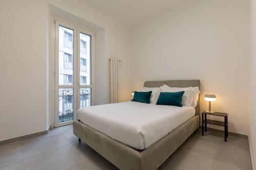 Postel nebo postele na pokoji v ubytování BePlace Apartments in Gioia