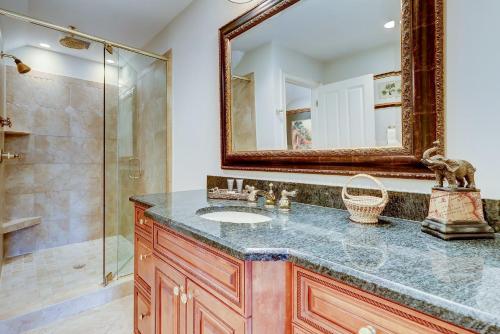 a bathroom with a sink and a mirror at GE317: 317 Glen Eagle in Kiawah Island
