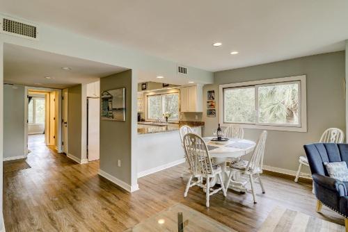 a kitchen and dining room with a table and chairs at SG8C: 8C Seagrove Villa in Isle of Palms