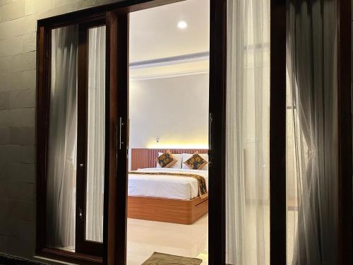 Ένα ή περισσότερα κρεβάτια σε δωμάτιο στο Uma Swari Villa Sidemen