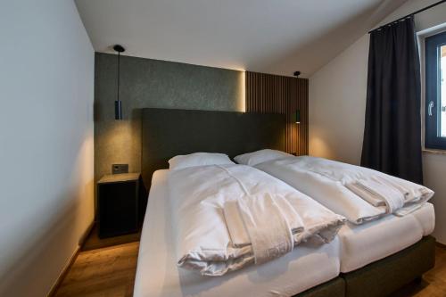 Katil atau katil-katil dalam bilik di MiLa Apartments