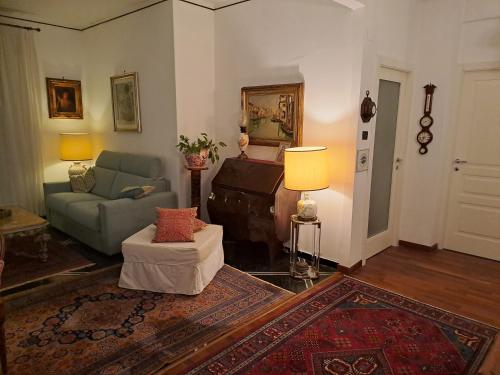 a living room with a couch and a chair at b&bEuropa in Genova