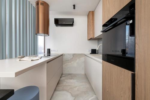 Foto Klimatyzowany Apartament Blisko Parku w Krakowie z 3 Sypialniami, Wanną i Parkingiem by Renters Prestige 5