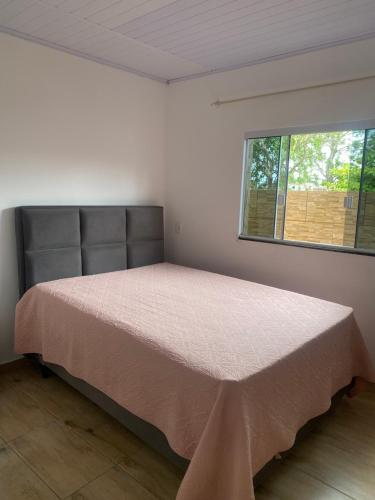 Postel nebo postele na pokoji v ubytování Casa de praia