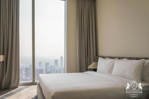 Postel nebo postele na pokoji v ubytování Westminster Forte Burj Khalifa