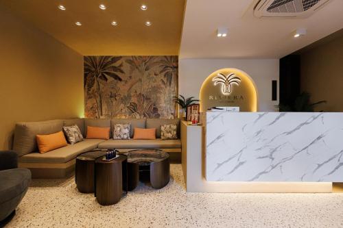 a living room with a couch and a table at Riviera Royal Hotel in Conakry