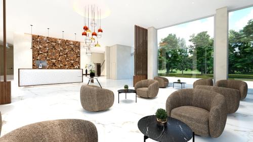 a lobby with chairs and a projection screen at SH Campus Lyceum in Moncada