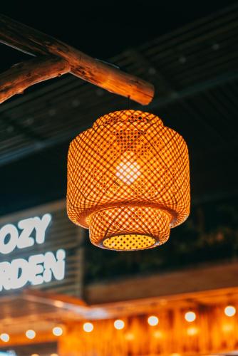 a yellow traffic light hanging from a ceiling at Tam Coc Lavender Homestay -Authentic Ninh Binh Experiences in Ninh Binh