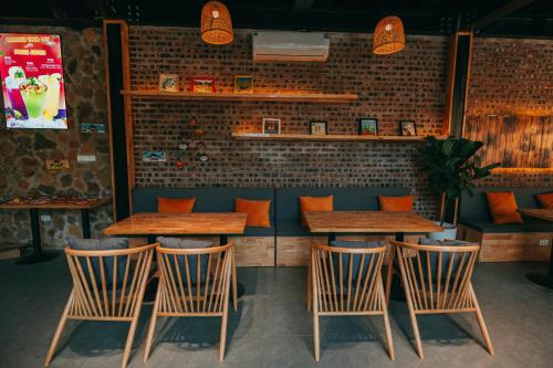 a restaurant with four tables and four chairs at Tam Coc Lavender Homestay -Authentic Ninh Binh Experiences in Ninh Binh