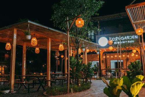 a restaurant with lights in front of it at night at Tam Coc Lavender Homestay -Authentic Ninh Binh Experiences in Ninh Binh