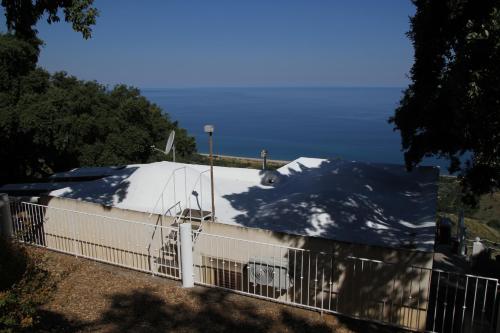a white building with snow on top of it at Villa DAMMUSO by Local House - private villa infinity pool & seaview in Santo Stefano di Camastra