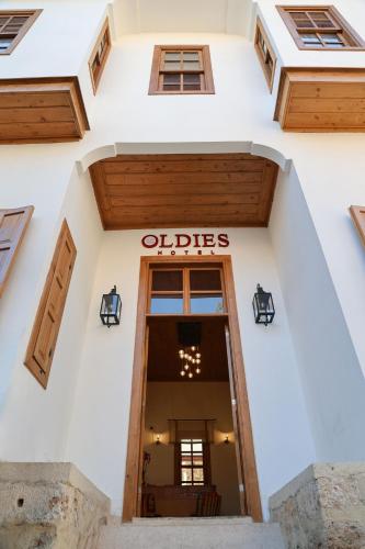 an entrance to an old dallas building at Oldies Hotel in Antalya
