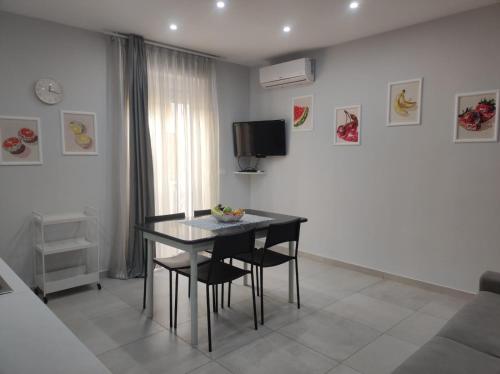 TV a/nebo společenská místnost v ubytování Casa Orchidea Mazzeo
