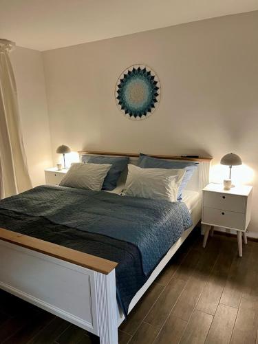 a bedroom with a large bed and two night stands at Domek Prosetin244 in Prosetín