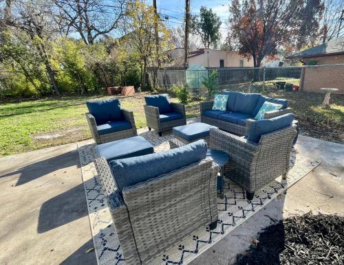 a group of chairs and couches on a patio at Villa de Siglo-Century Villa in Abilene