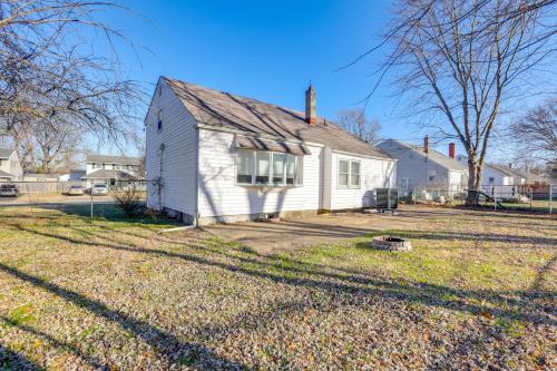 a small white house in a yard at 3 Mi to Dtwn Home with Yard in Newark in Newark